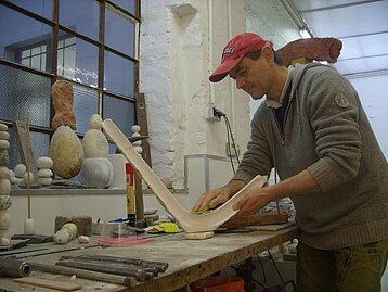 Peter finishing one of his sculptures