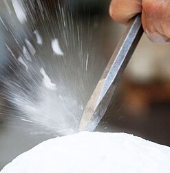 Carving marble in the studio